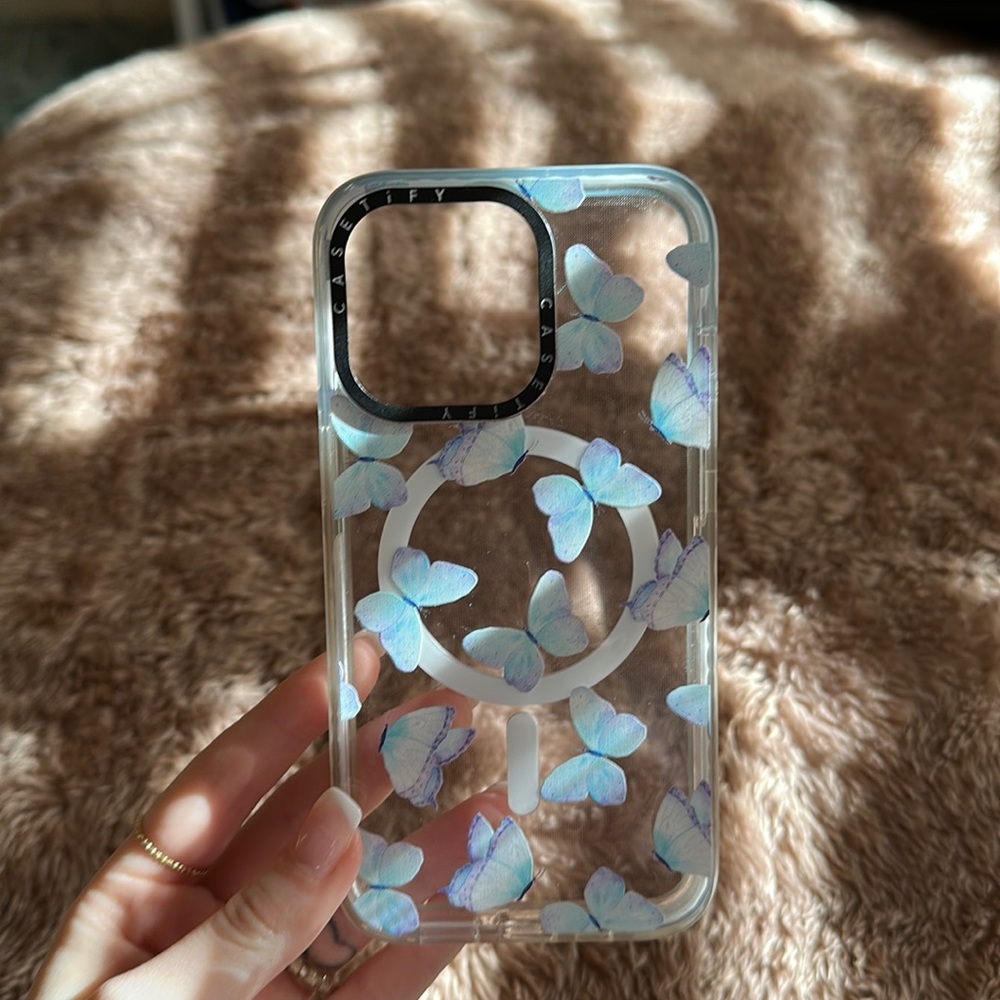 Casetify iPhone 13 Pro MagSafe case with butterflies.